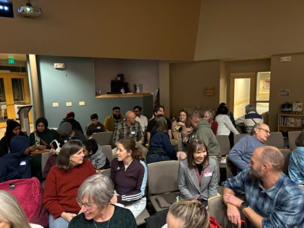Diverse group in conversation at a community gathering