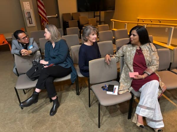 Attendees in conversation at the Abraham's Bridge film screening