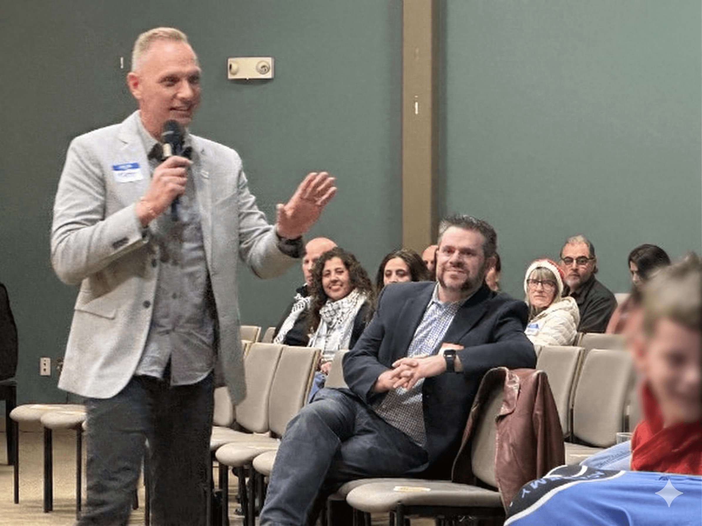 Speaker addressing the audience at the Abraham's Bridge film screening